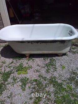 Antique Clawfoot tub 98 Years Old, Cast Iron, Porcelain Interior With 4 Feet